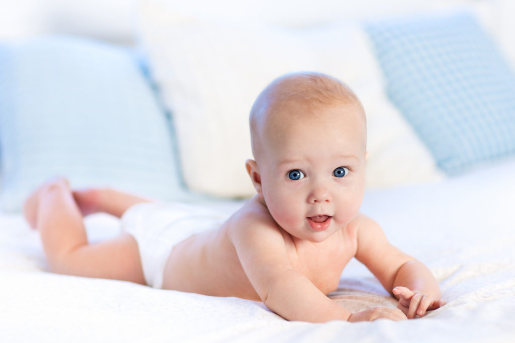 When do babies roll over from tummy to back?